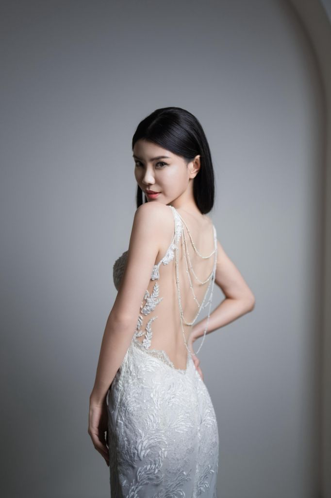 Bridal portrait with beaded illusion back on a fitted lace gown
