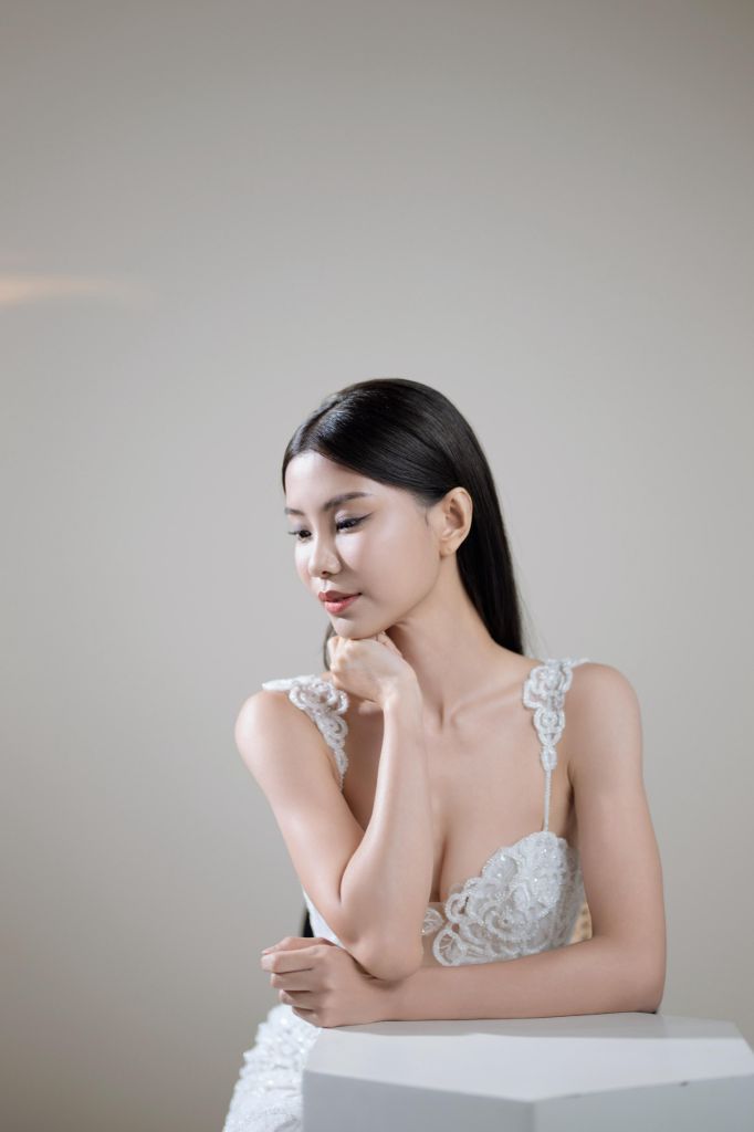Studio bridal portrait with soft natural makeup and lace gown