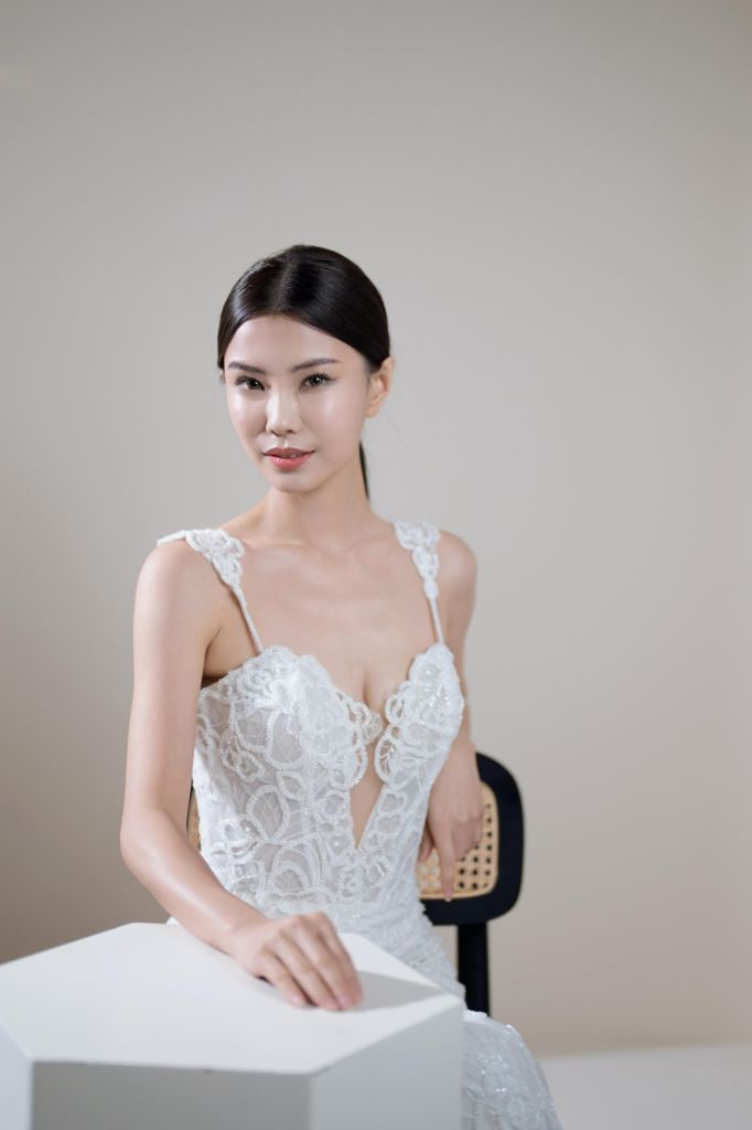 Bridal portrait with lace gown in a clean studio setting