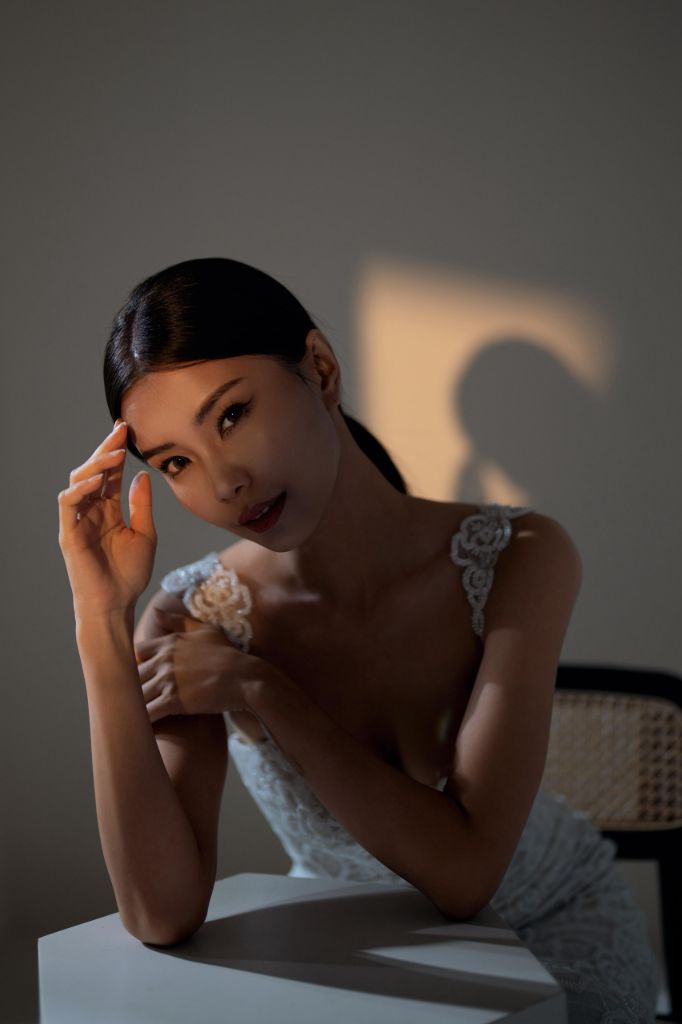 Bridal portrait with smoky eye makeup in dramatic studio lighting